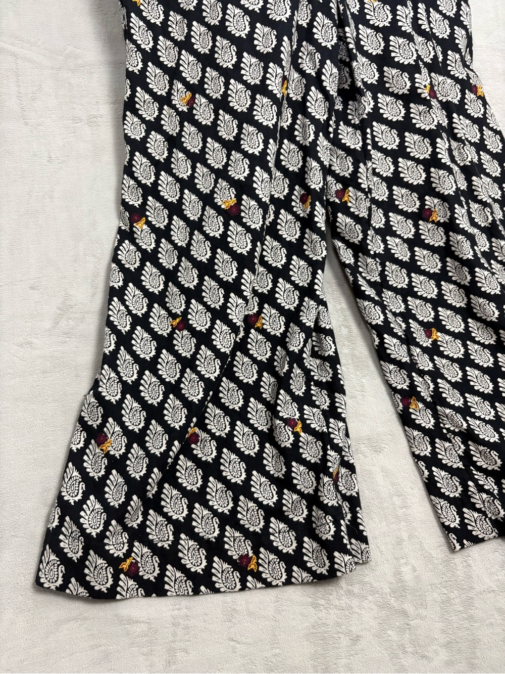 Anthropologie Black Patterned Wide-Leg Bib Jumpsuit with Floral Accents - Picture 2 of 12